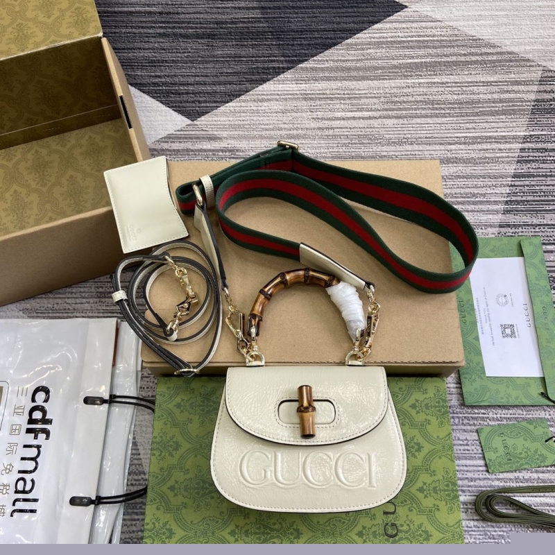 G*u*i top handle bags